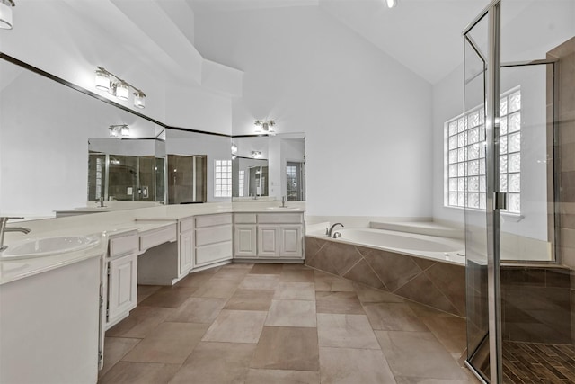 bathroom with tile patterned floors, vanity, plus walk in shower, and high vaulted ceiling