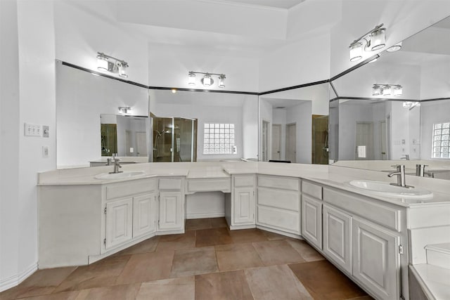 bathroom featuring vanity, an enclosed shower, and a high ceiling