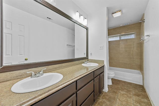 full bathroom with shower / tub combination, vanity, toilet, and tile patterned flooring