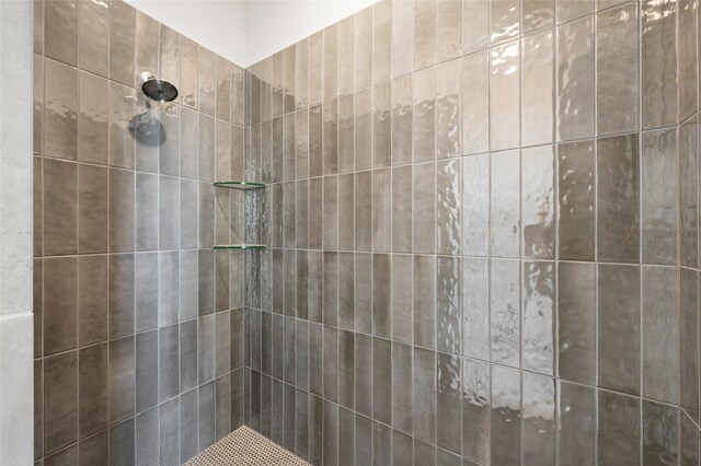 full bathroom with tiled shower