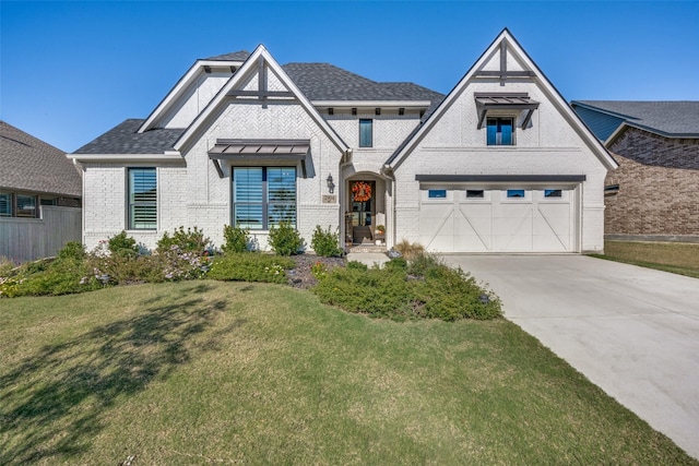 view of front of home featuring a garage and a front yard