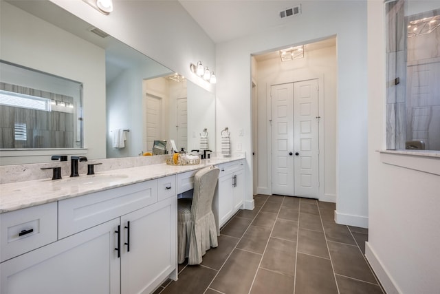 bathroom featuring tile patterned floors and vanity