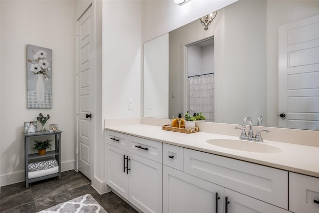 bathroom featuring vanity and a shower with shower curtain