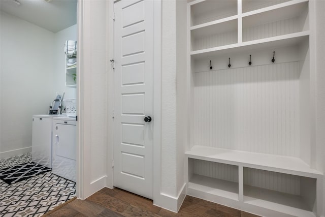 mudroom featuring dark hardwood / wood-style floors and washer and clothes dryer