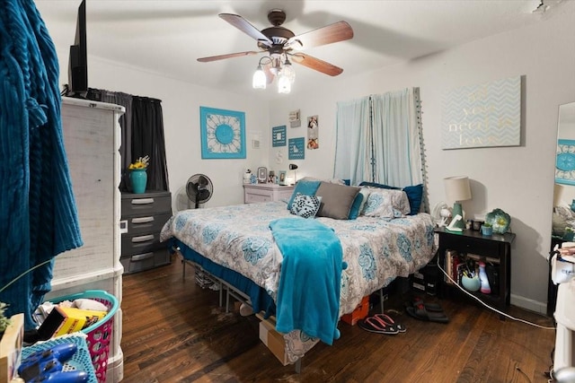 bedroom featuring ceiling fan and dark wood-type flooring