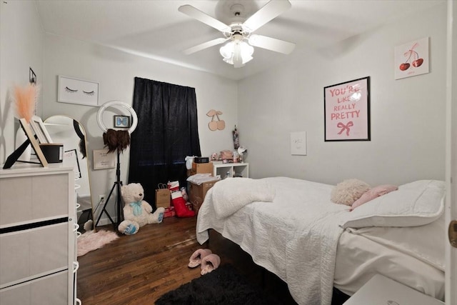 bedroom with ceiling fan and dark hardwood / wood-style floors