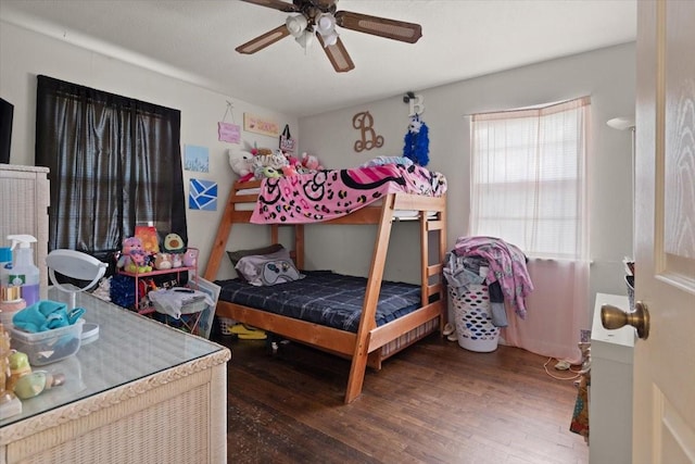 bedroom with hardwood / wood-style flooring and ceiling fan