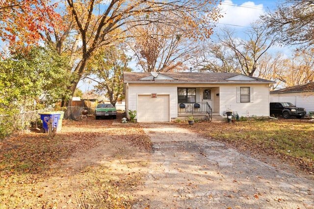 view of front of home featuring a porch and a garage