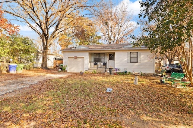 ranch-style house featuring a porch and a garage