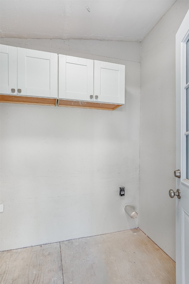 laundry room with cabinets