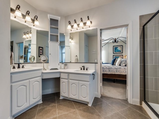 bathroom featuring tile patterned flooring, vanity, and a shower with shower door