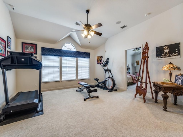 exercise area featuring ceiling fan, carpet floors, and vaulted ceiling