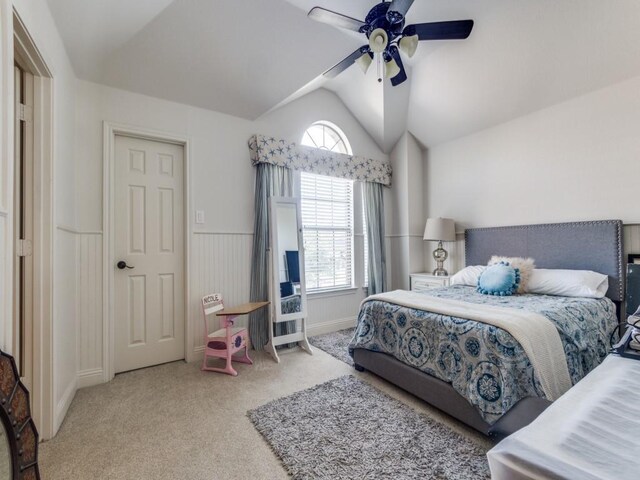 cinema room with wet bar, light carpet, wine cooler, and vaulted ceiling