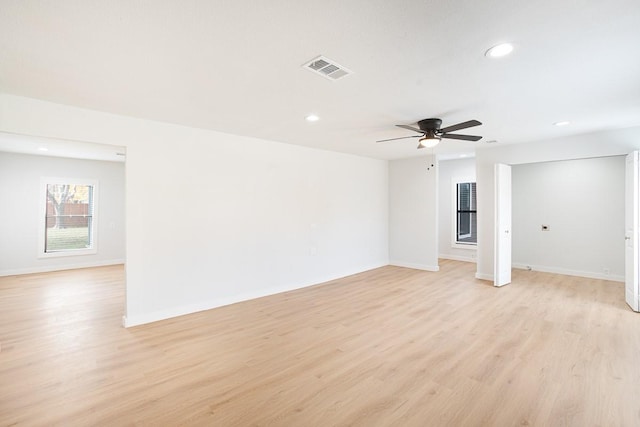 spare room featuring light hardwood / wood-style floors and ceiling fan