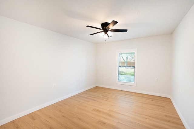 empty room with ceiling fan and light wood-type flooring