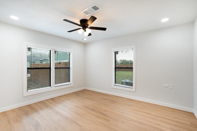 spare room featuring ceiling fan and light hardwood / wood-style flooring