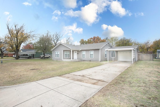 ranch-style home with a garage and a front lawn