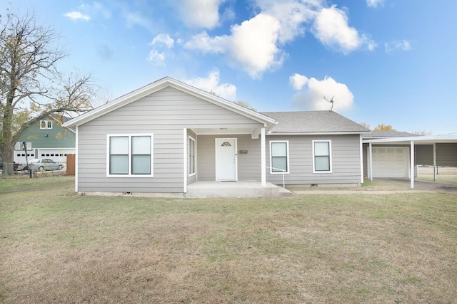 view of front facade featuring a front lawn and a carport