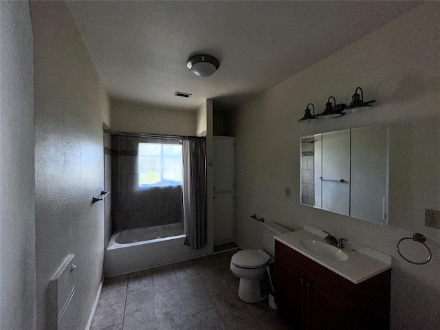 full bathroom featuring vanity, shower / tub combo with curtain, and toilet