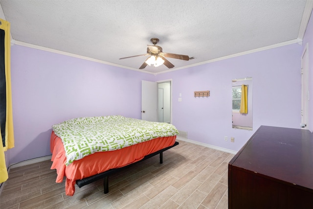 bedroom featuring hardwood / wood-style floors, a textured ceiling, ceiling fan, and ornamental molding