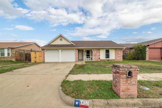 single story home featuring a front yard and a garage