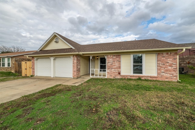 ranch-style house with central AC unit, a garage, and a front lawn