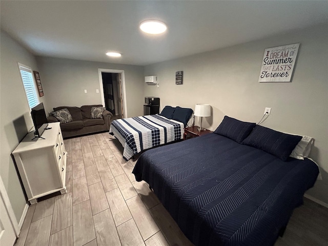 bedroom with an AC wall unit
