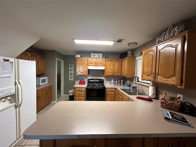 kitchen with kitchen peninsula, light tile patterned floors, white appliances, and sink