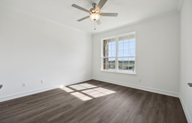 empty room featuring dark wood-type flooring, ceiling fan, and crown molding