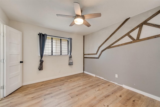 spare room with ceiling fan and light hardwood / wood-style flooring