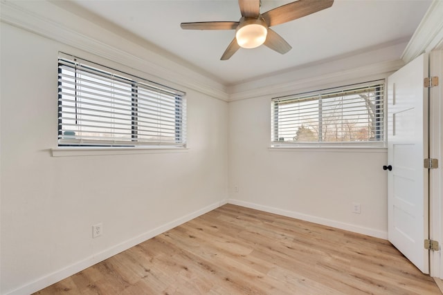 spare room with ceiling fan, light hardwood / wood-style flooring, and crown molding