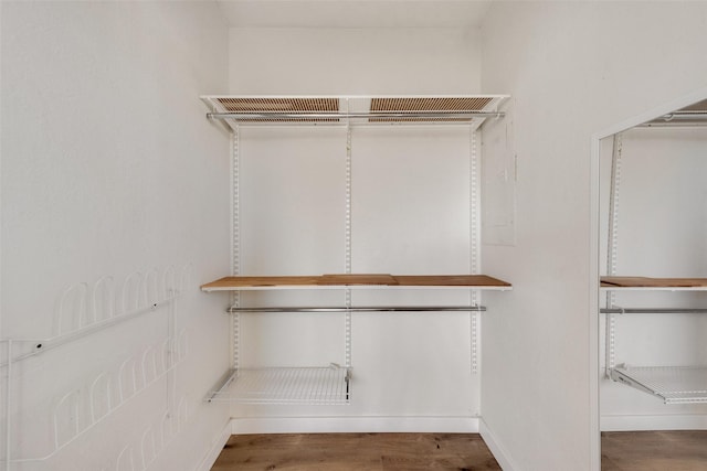 walk in closet featuring wood-type flooring