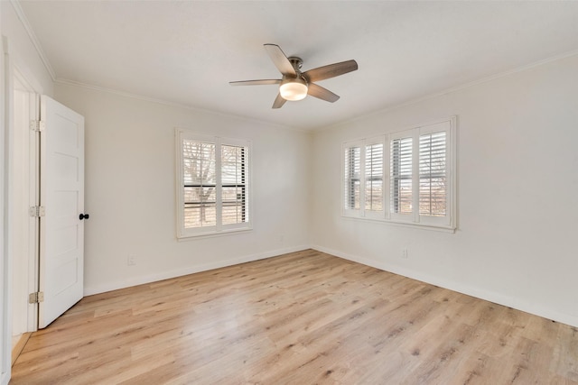 spare room featuring ceiling fan, ornamental molding, and light hardwood / wood-style flooring