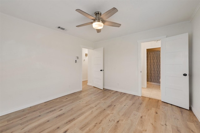 unfurnished bedroom with ceiling fan, crown molding, and light wood-type flooring