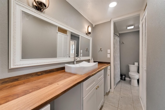 bathroom with curtained shower, ornamental molding, vanity, toilet, and tile patterned floors