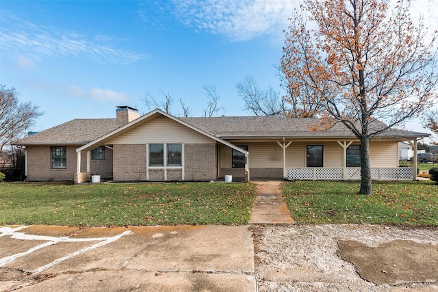 ranch-style home with a front yard