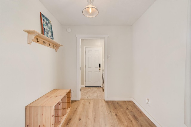 hallway with hardwood / wood-style floors