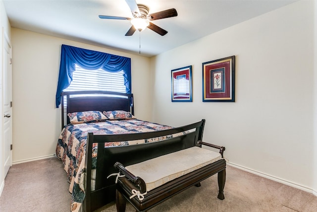 bedroom with ceiling fan and carpet floors