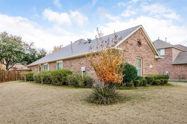 view of home's exterior with a lawn