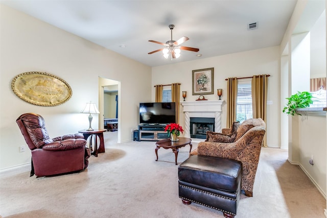 carpeted living room featuring ceiling fan