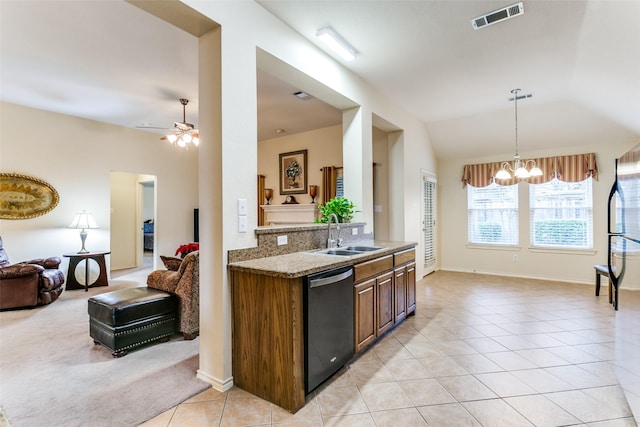 kitchen with light stone countertops, sink, stainless steel dishwasher, lofted ceiling, and light tile patterned floors