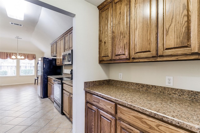 kitchen featuring a chandelier, light tile patterned floors, lofted ceiling, and black appliances