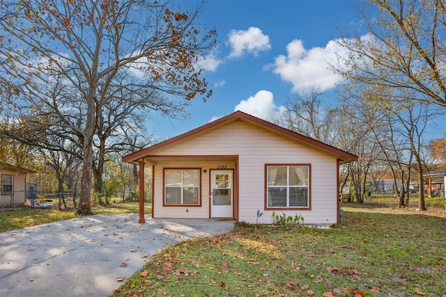 bungalow-style house with a front yard