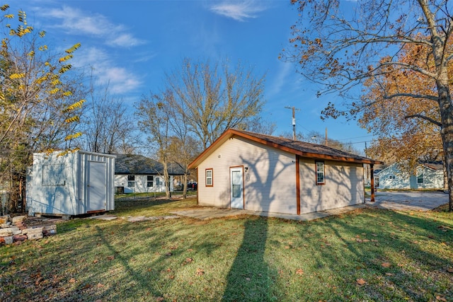 exterior space with a shed and a lawn