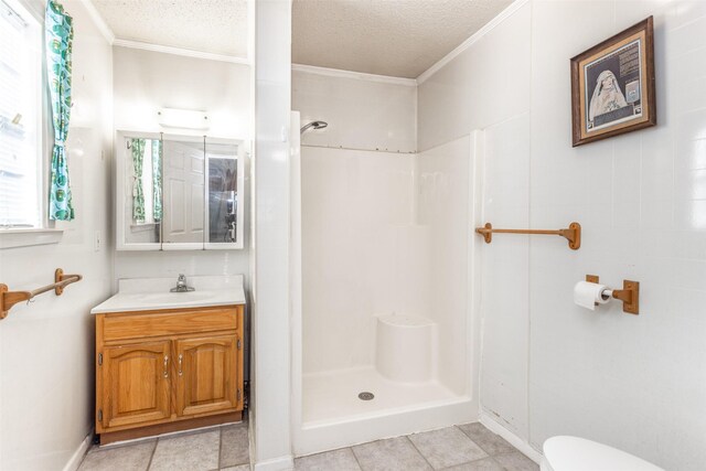 bathroom with vanity, a textured ceiling, crown molding, a shower, and toilet