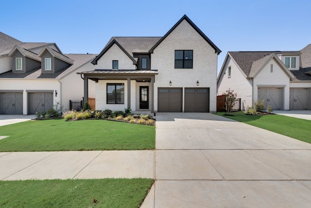 view of front facade with a garage, a front yard, and a porch