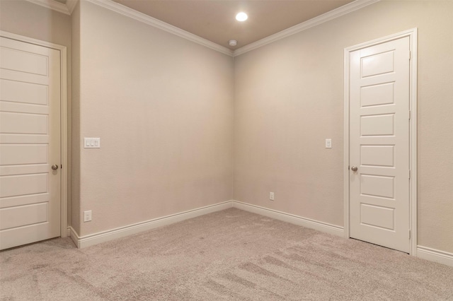 carpeted empty room featuring ornamental molding