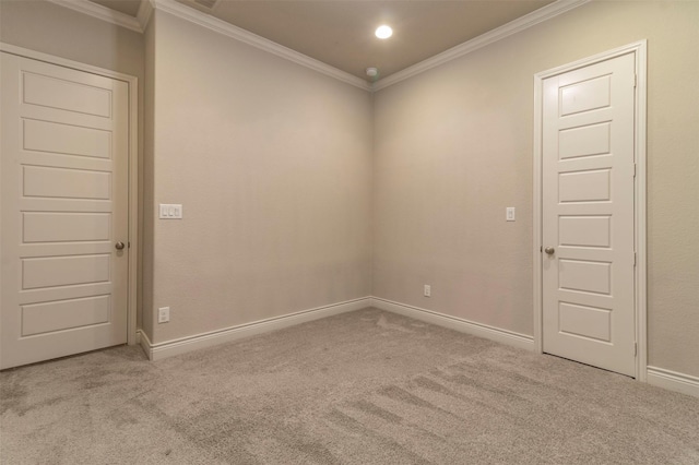 carpeted spare room with ornamental molding