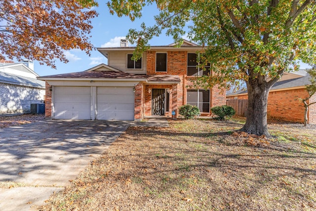 view of front of house featuring a garage and cooling unit