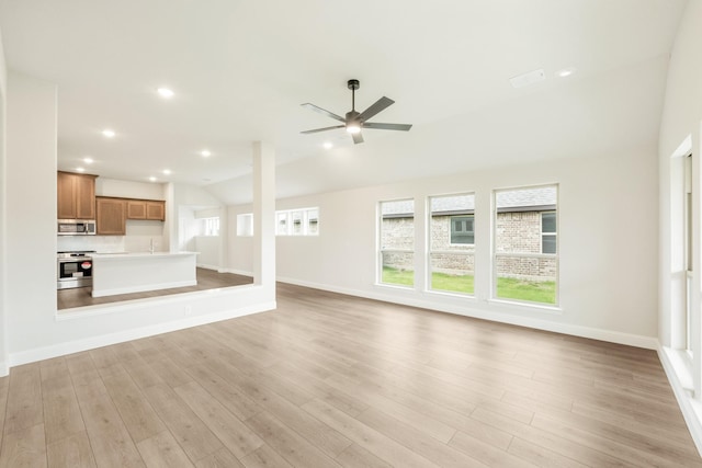 unfurnished living room featuring baseboards, light wood-style flooring, and ceiling fan